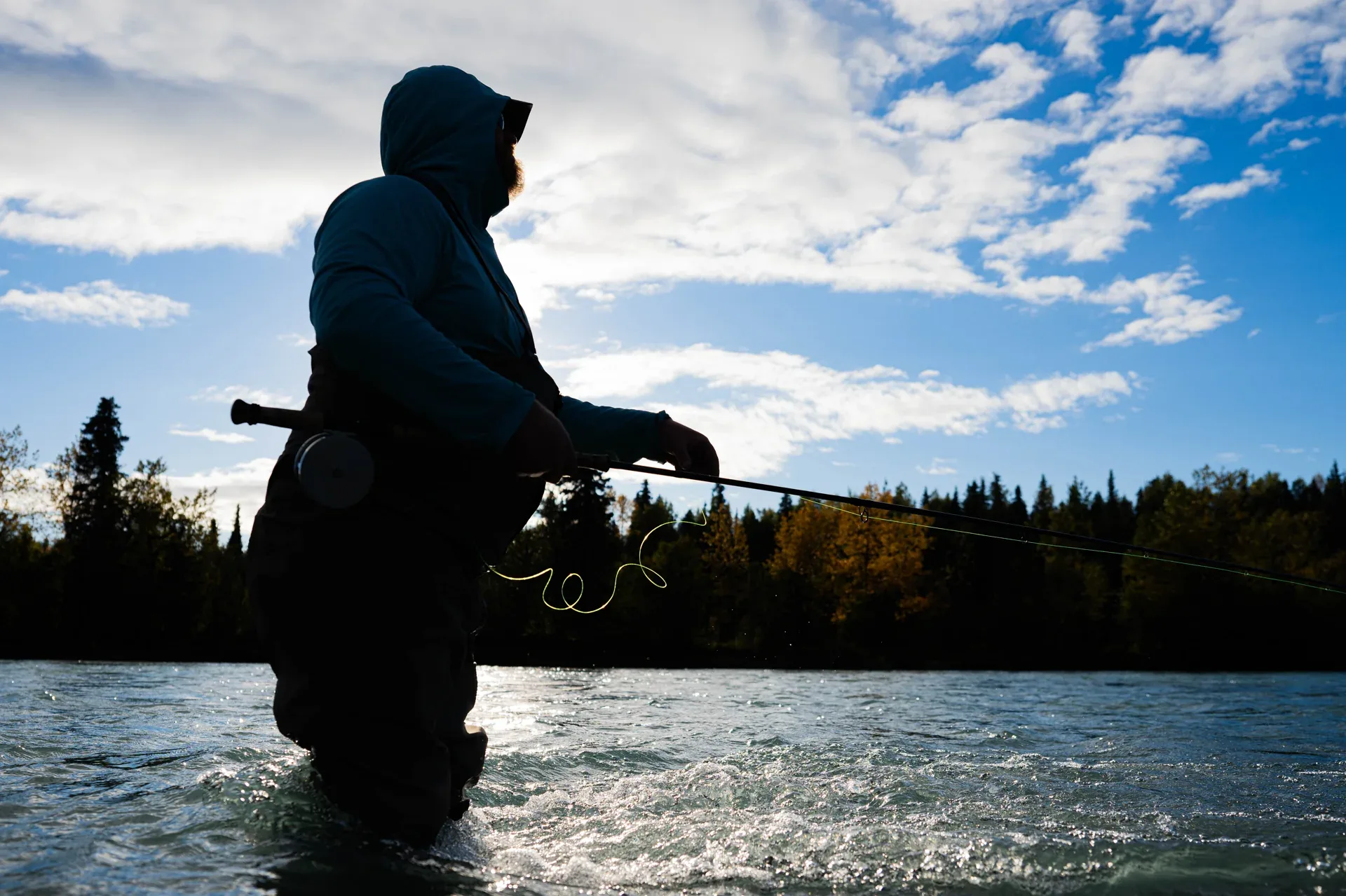 Angler working a seam on a bigger Kenai Peninsula river with a switch rod